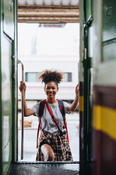 Tourists african american are showing happy expressions while waiting for their journey in the train station