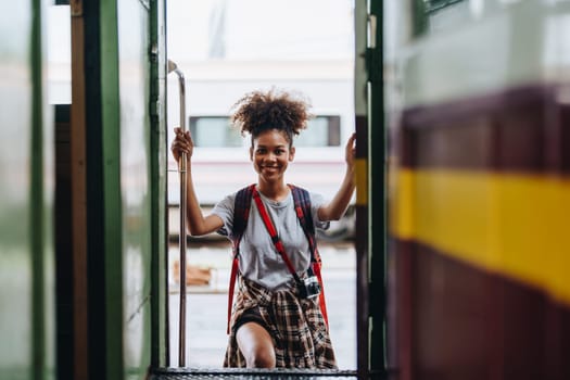 Tourists african american are showing happy expressions while waiting for their journey in the train station