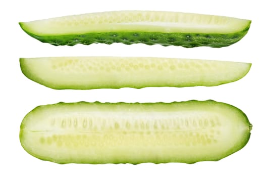 Long slices of green cucumbers on a white isolated background. Cucumber slices on white. The concept of a delicious addition to a salad. High quality photo.