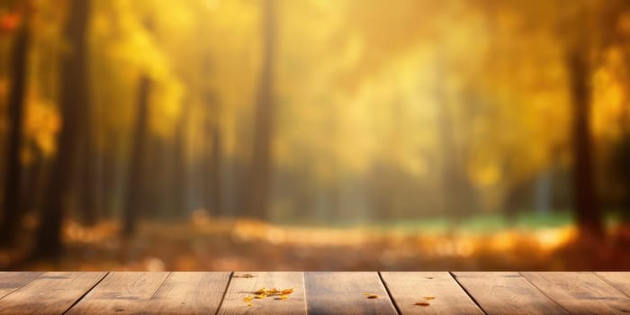 The empty rustic wooden table for product display with blur background of autumn forest. Exuberant image.