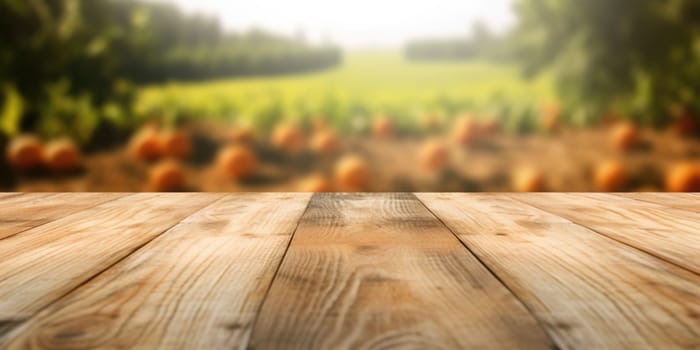 The empty wooden brown table top with blur background of farm. Exuberant image.