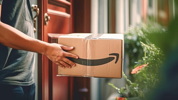 Faceless delivery man holding Amazon prime cardbox parcel box blurred street background. Generative ai