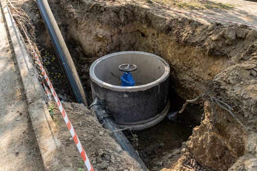 A valve or valve in a valve concrete well of an underground sewer. Construction of pipeline networks. Laying of the pipeline of the water supply system in the city. Water supply, repair of worn-out pipelines.