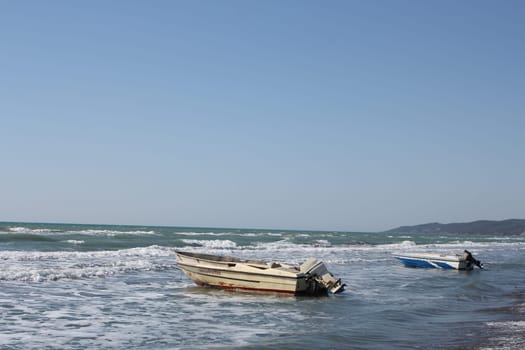 Boat near the sea shore at daytime. Boat used for fishing