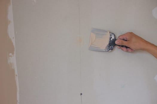 the master plasters the walls and ceiling. Selective focus