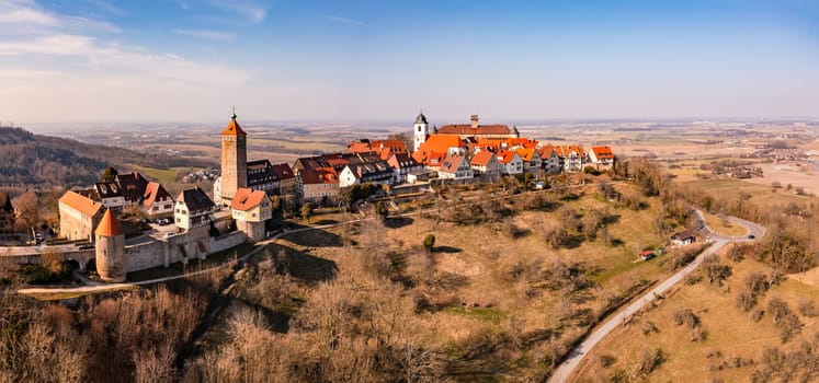 The scenic travel destination of Waldenburg in Hohenlohe in winter from a drone perspective