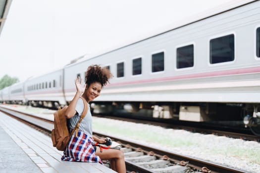 Asian teenage girl african american traveler dressed in casual wear holding map and searching right direction of route