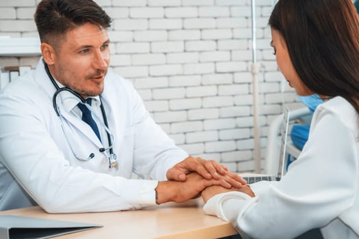 Doctor in professional uniform examining patient at hospital or medical clinic. Health care , medical and doctor staff service concept. Jivy