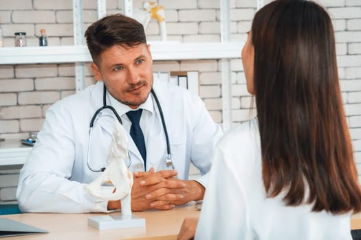 Doctor in professional uniform examining patient at hospital or medical clinic. Health care , medical and doctor staff service concept. Jivy