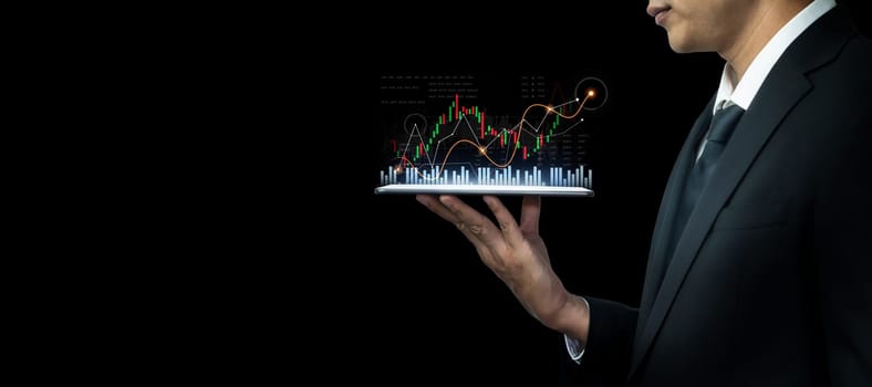 Businessman analyst working with digital finance business data graph showing technology of investment strategy for perceptive financial business decision. Digital economic analysis technology concept.