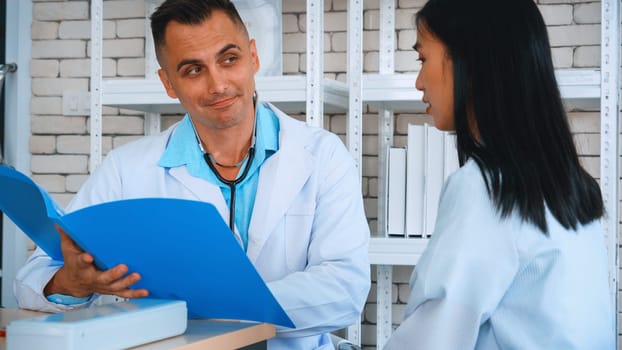 Doctor in professional uniform examining patient at hospital or medical clinic. Health care , medical and doctor staff service concept. Jivy