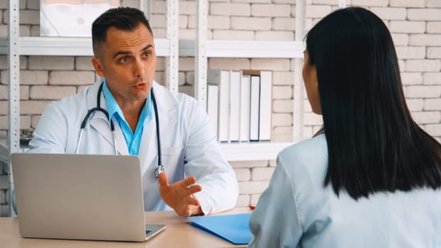 Doctor in professional uniform examining patient at hospital or medical clinic. Health care , medical and doctor staff service concept. Jivy