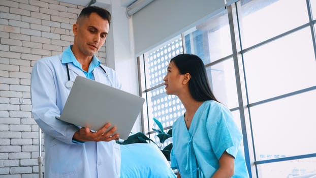 Doctor in professional uniform examining patient at hospital or medical clinic. Health care , medical and doctor staff service concept. Jivy