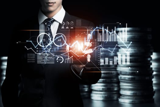 Businessman analyst working with digital finance business data graph showing technology of investment strategy for perceptive financial business decision. Digital economic analysis technology concept.