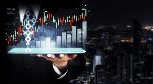 Businessman analyst working with digital finance business data graph showing technology of investment strategy for perceptive financial business decision. Digital economic analysis technology concept.