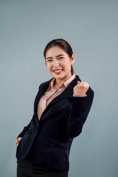 Confident young asian businesswoman in formal suit making hand gesture to indicate promotion or advertising with surprised face expression and gesture on isolated background. Enthusiastic