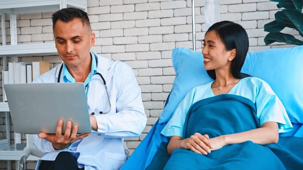 Doctor in professional uniform examining patient at hospital or medical clinic. Health care , medical and doctor staff service concept. Jivy