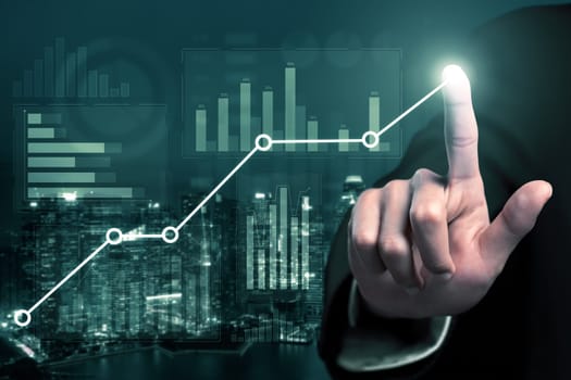 Businessman analyst working with digital finance business data graph showing technology of investment strategy for perceptive financial business decision. Digital economic analysis technology concept.