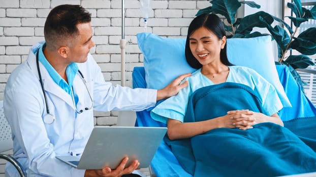 Doctor in professional uniform examining patient at hospital or medical clinic. Health care , medical and doctor staff service concept. Jivy