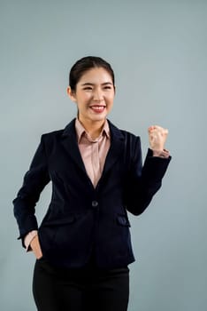 Confident young asian businesswoman in formal suit making hand gesture to indicate promotion or advertising with surprised face expression and gesture on isolated background. Enthusiastic