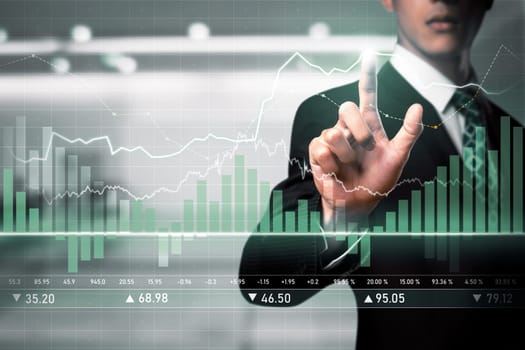 Businessman analyst working with digital finance business data graph showing technology of investment strategy for perceptive financial business decision. Digital economic analysis technology concept.