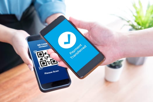 Seamless cashless payments with barcode scanning on smartphone application. Utilizing QR code technology, secure and fast transactions for modern shopping lifestyle with mobile banking app. Jubilant