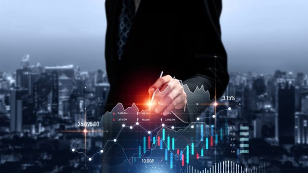 Businessman analyst working with digital finance business data graph showing technology of investment strategy for perceptive financial business decision. Digital economic analysis technology concept.