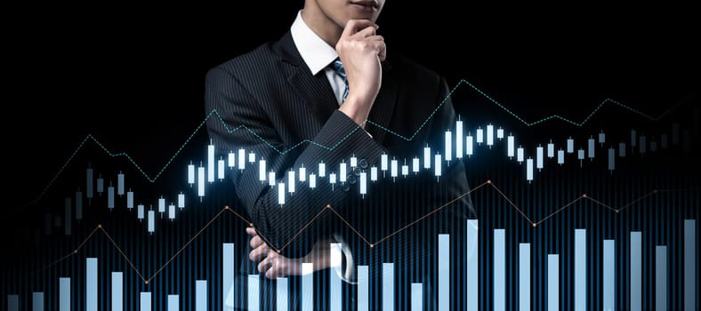 Businessman analyst working with digital finance business data graph showing technology of investment strategy for perceptive financial business decision. Digital economic analysis technology concept.