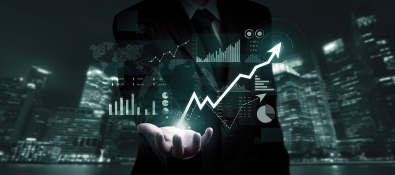 Businessman analyst working with digital finance business data graph showing technology of investment strategy for perceptive financial business decision. Digital economic analysis technology concept.