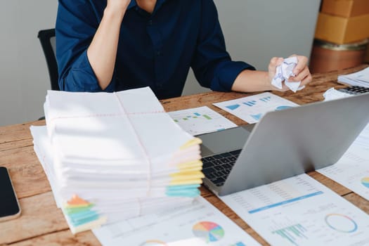 Portrait of business owner, man using computer and financial statements Anxious expression on expanding the market to increase the ability to invest in business