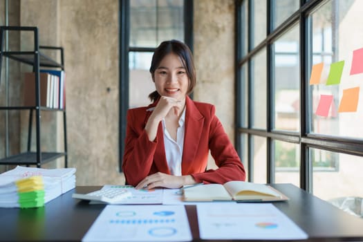 Portrait of a woman business owner showing a happy smiling face as he has successfully