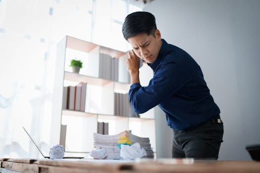 Portrait of business owner, man using computer and financial statements Anxious expression on expanding the market to increase the ability to invest in business