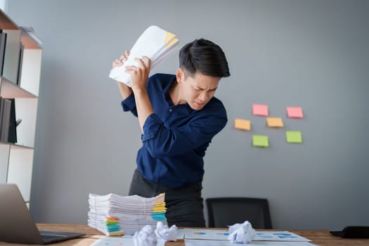 Portrait of business owner, man using computer and financial statements Anxious expression on expanding the market to increase the ability to invest in business