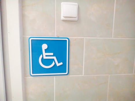 Handicap sign showing place for toilet symbolizing disability and mobility problems showing accessibility and safety.