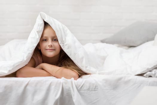 happy morning baby in bed. child dabbles in bed