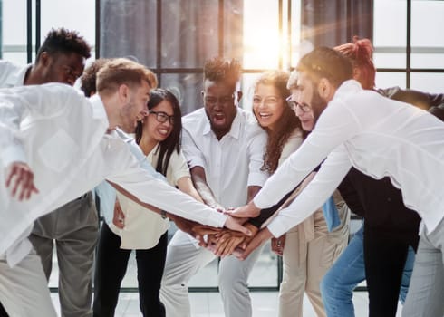 Teamwork and team spirit ,handshake in a group after work succe