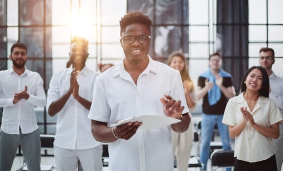 Happy business people applauding a good presentation