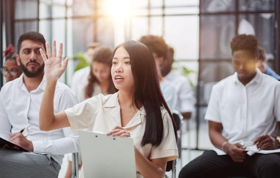 Diverse people participating in a group business training session