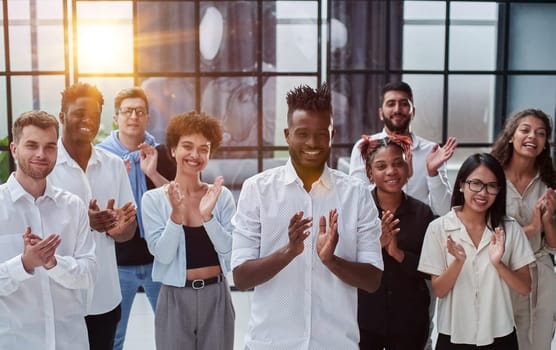 Business people with raised arms during seminar