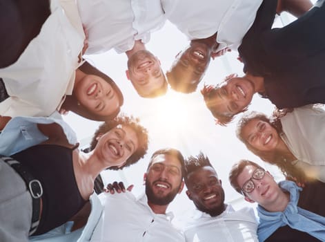 happy team of diverse corporate employees in the office lobby.