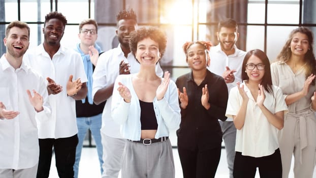 arge international group of happy people applauding together