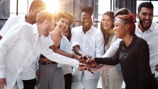 Teamwork and team spirit ,handshake in a group after work succe
