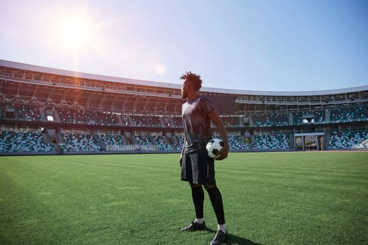 African American soccer player during match inside large stadium