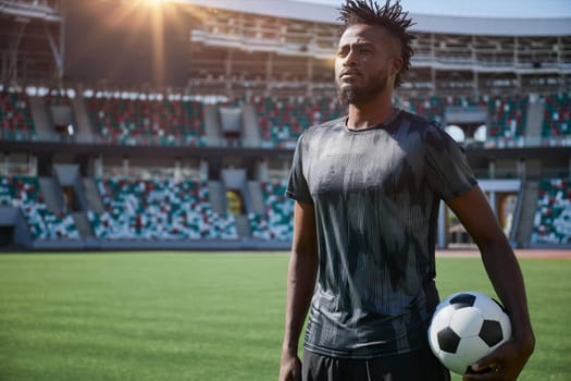 African American soccer player during match inside large stadium