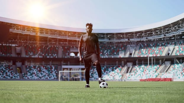African American soccer player during match inside large stadium