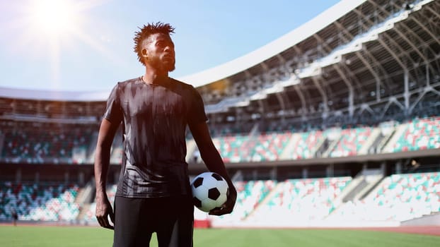 African American soccer player during match inside large stadium
