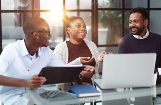 Business team in an office smiling at the camera