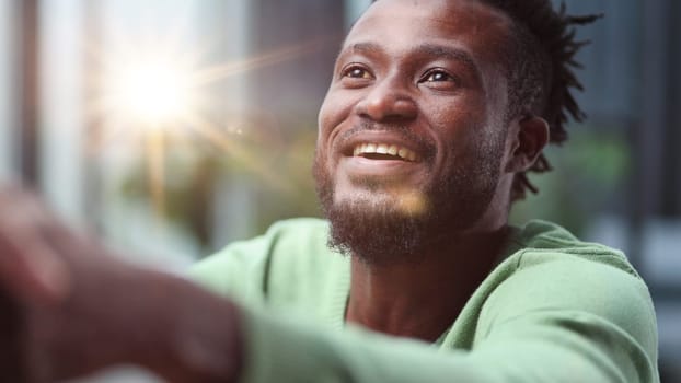 Close up front portrait smiling young black man
