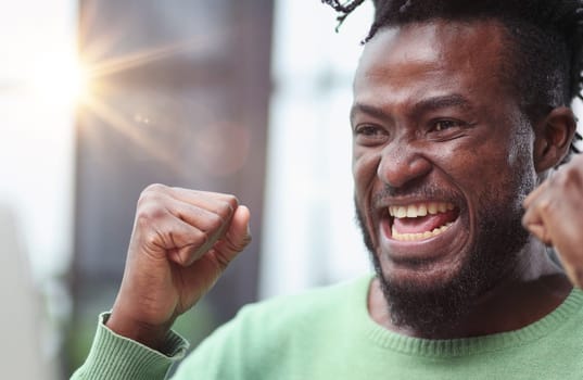 Head and shoulders portrait of contemporary African-American man smiling at camera