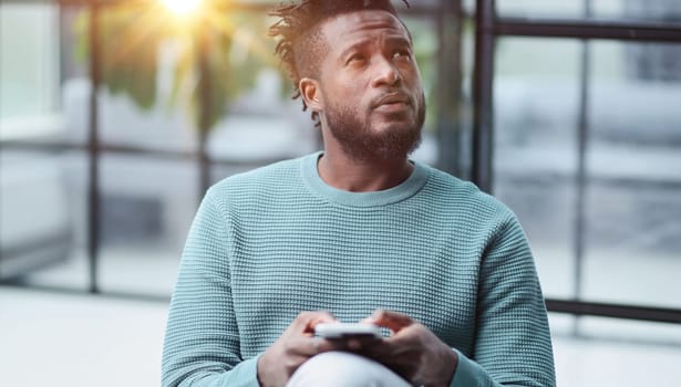 african american businessman using phone mobile corporate apps at workplace texting sms.